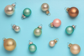 Christmas or New Year Festive pastel Christmas balls over blue background