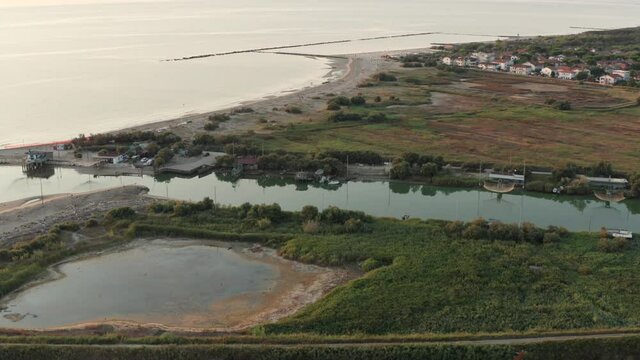 Aerial view of fishing huts with typical italian fishing machine, called ""trabucco"",Lido di Dante, fiumi uniti Ravenna near Comacchio valley.