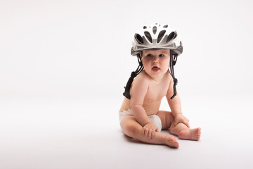 baby in a larger bicycle helmet, on a white background.