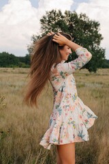 Side view pretty woman with long beautiful hair at nature  - 455219363