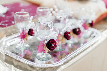 Red and gold festive decoration. Cookies, flowers, food on the birthday table. Wedding table. Festive background