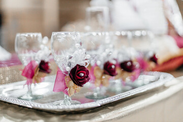 Red and gold festive decoration. Cookies, flowers, food on the birthday table. Wedding table. Festive background