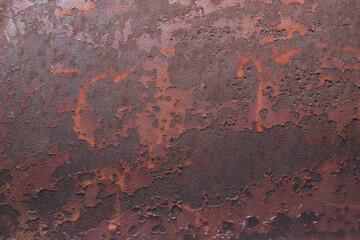 old rusted metal plate with chipped paint