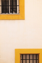 Obraz premium Two windows with yellow frame in Nijar, Andalusia, Spain