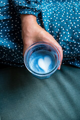 woman with fresh blue matcha with frothy foam