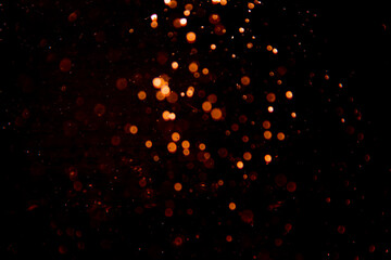 Abstract gold bokeh on black background