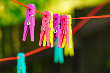 Clothes pegs on line outdoor. Housework