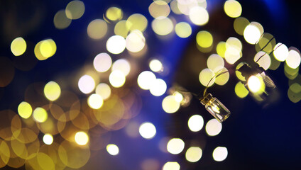 Christmas garland of glass bottles. New year and christmas concept. A garland of light bulbs with a beautiful light and bokeh