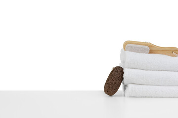 Spa still life with stacked of stone and towel isolated on white