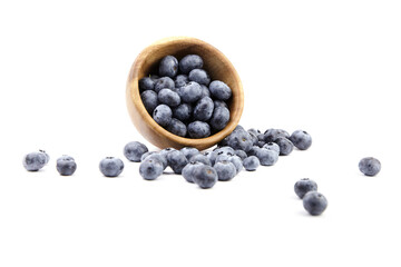 Blueberry in wooden bowl isolated on white background