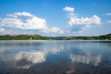 beautiful background of blue lake and sky reflection