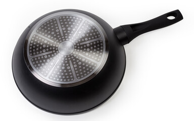 Inverted frying pan made of forged aluminum on white background