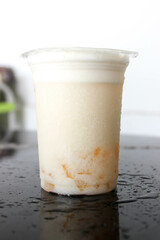 fresh milk drink with orange yogurt and jelly on black table