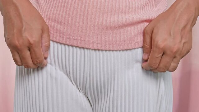 Female hands scratching crotch with leucorrhoea, vaginitis, problems of bacterial vaginosis, vaginal itching and unpleasant smell. Gynecological and health care concept.