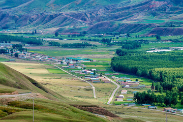 Village in canyon of Tekasi county Yining city Xinjiang Uygur Autonomous Region, China.