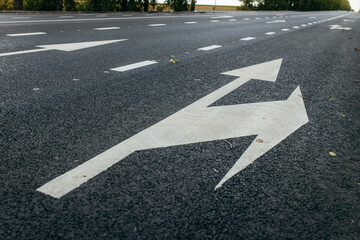 Road lanes with white arrow markings