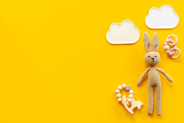 Baby toy rabbit with wooden accessories, overhead view