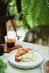 Coconut Cake and Coffee in a cafe on the blur background. traditional dessert Sliced of delicious coconut layer cake