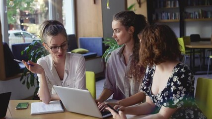 Three mature students discussing new project in library - Powered by Adobe