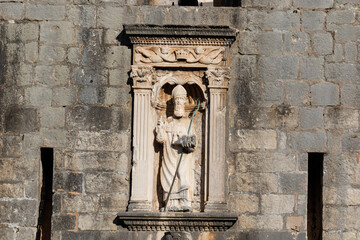 Sculpture of Saint Vlaho (Blaise), patron saint of the city of Dubrovnik, above the city gate of Pile in Dubrovnik, Croatia