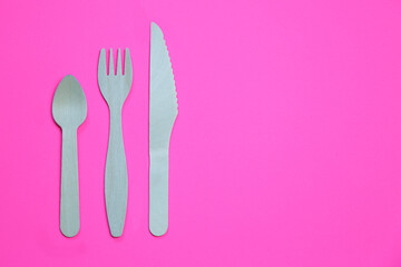 Eco friendly bamboo cutlery set on pink background. Zero waste concept.