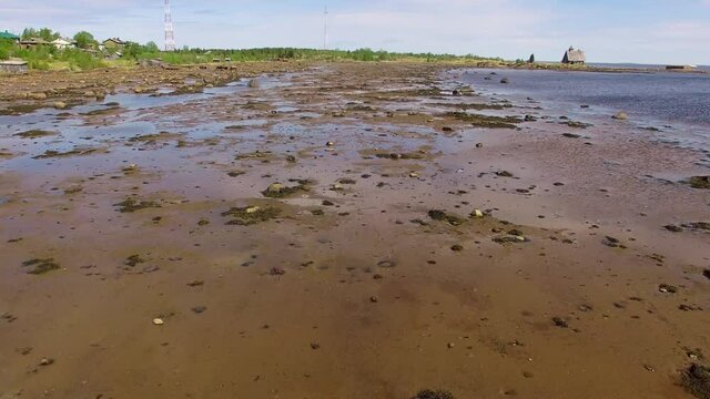 Low tide coast aerial drone footage, eco tourism and ecology Solovki Russia 4K