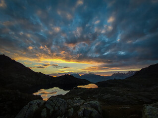 sunrise, sunset, high mountain lake adamello brenta, italy, dolomites