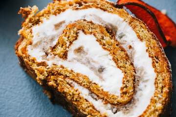 Roll dessert with mascarpone cheese and nuts in a biscuit.