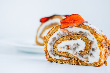 Roll dessert with mascarpone cheese and nuts in a biscuit.