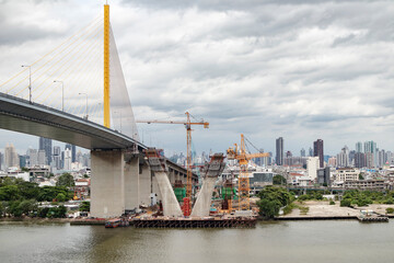 Fototapeta premium The back of a tower crane in Thailand taken on the side of the Chao Phaya River.