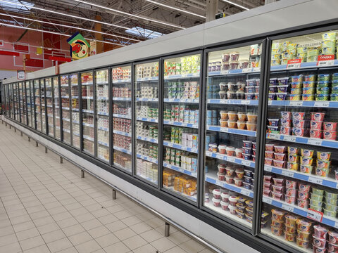 Shelves with dairy products in a supermarket
