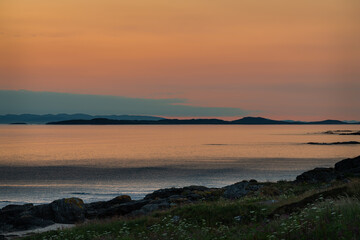 Sunset on the Mull of kintyre looking at the Isle of Islay in Argyll and Bute, Scotland