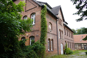 Fototapeta premium The former school Mirow Mecklenburg-Western Pomerania, next to the Lower Castle on the castle island, was a primary school and later a primary school until 2015.The building is a historical monument.