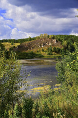 Fototapeta na wymiar Rock outcrop Kamen Lobach on the right slope of the Sylva river valley.