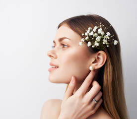 Fototapeta premium pretty woman attractive look flowers in hair modern style