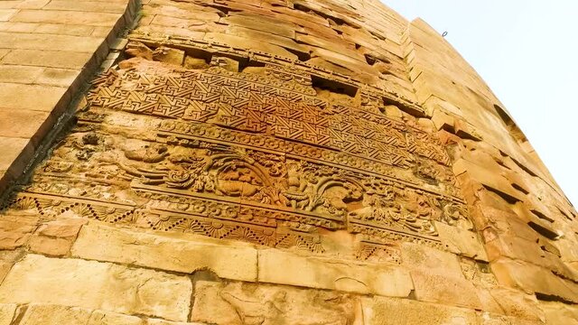 The Floral Carvings on the side of the Ancient Dhamek Stupa in Sarnath, Varanasi, India with Close Up Shot