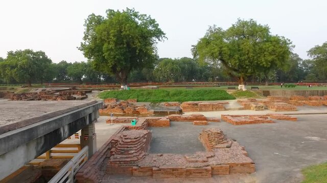 The Mulagandha Kuti Archaeological Buddhist Remains of Sarnath with Bricks and Stones in Sarnath, Varanasi, India. Panoramic Panning Shot from Left to Right.