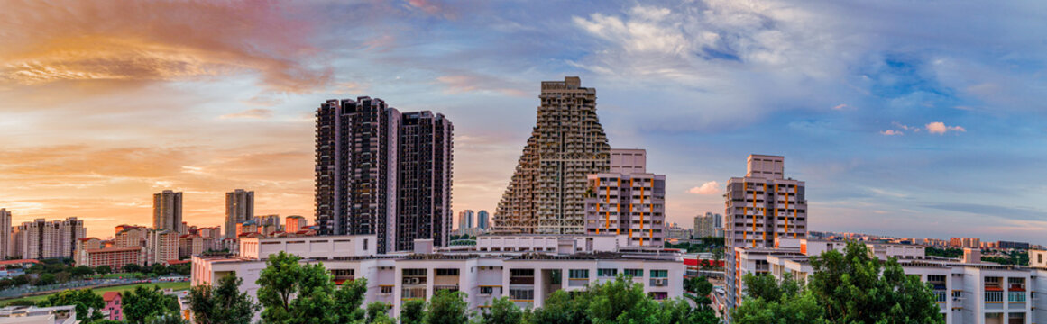 Panorama view of the Golden Hour sunset over the community parks and residential buildings in Bishan, Singapore 
