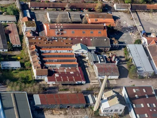 Fotobehang vue aérienne d'une usine à Mantes-la-Jolie dans les Yvelines en France © Francois