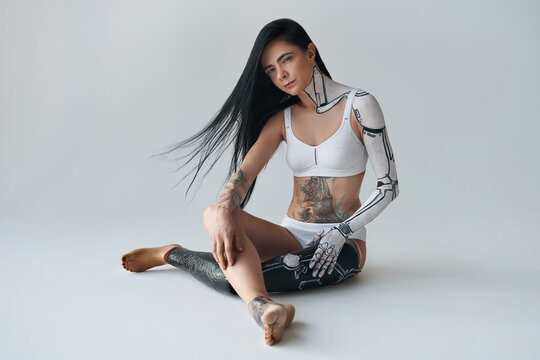 Woman From Future. Futuristic Creative Avant-garde Cyber Body Art At The Girl With Artificial Leg. People With Special Needs Concept