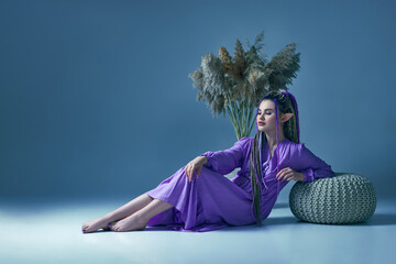 young and beautiful woman elf posing at camera