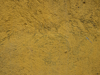 The texture of a plastered yellow wall