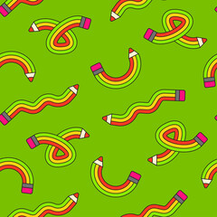 Seamless pattern with colorful pencils on green background.