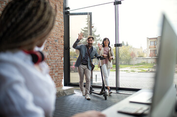 Young and old businesspeople working in office, coworking and eco commuting concept.