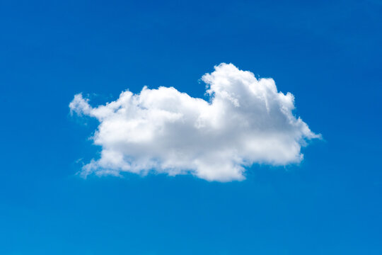 Nature single white cloud on blue sky background in daytime