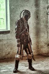 Aggressive post apocalyptic survivor in gas mask