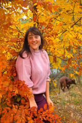 Girl in the autumn wood