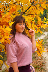 Girl in the autumn wood