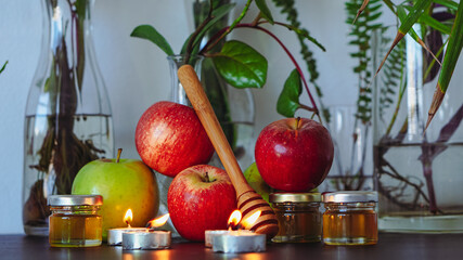 Rosh Hashanah Jewish New Year attributes - honey, apples, pomegranate, candles
