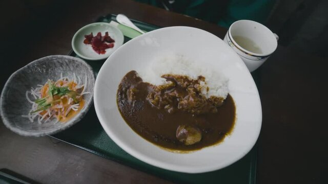 Japanese Curry Rice Meal In A Bowl Served With Side Dishes And Soup For Lunch. rotating shot